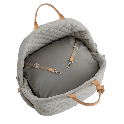 Convertible 3-in-1 dog travel bag in a quilted padded design, used as a pet carrier, car seat, or travel bed with reinforced handles and shoulder strap.