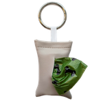 Gray color poop bag holder in vegan leather, handmade in Stockholm. The pouch features a metal ring and holds one roll of dog waste bags.